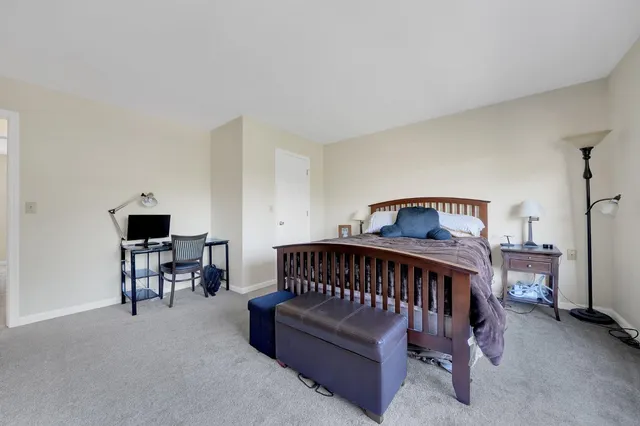 a bathroom with a tub a sink and mirror