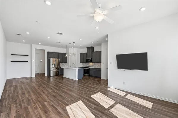 a view of kitchen with furniture and flat screen tv