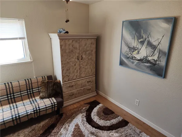 a room with furniture and wooden floor
