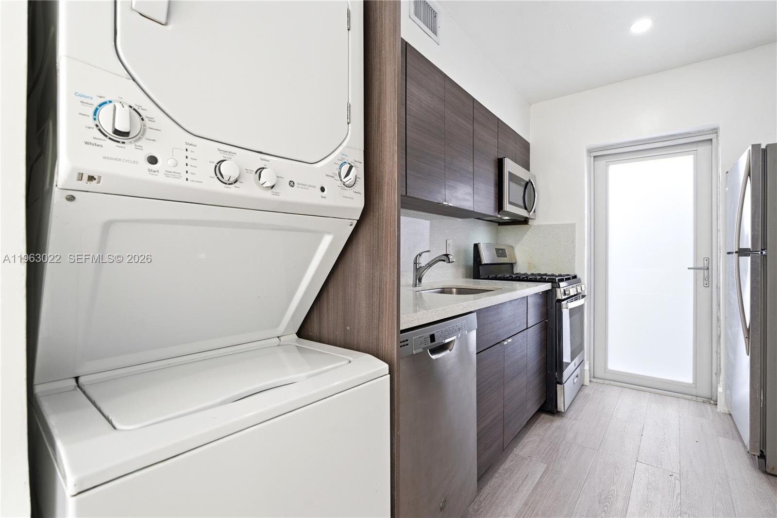 732 82nd Street, Unit 1 Miami Beach, FL 33141 - Photo 4 of 11 a utility room with dryer and washer