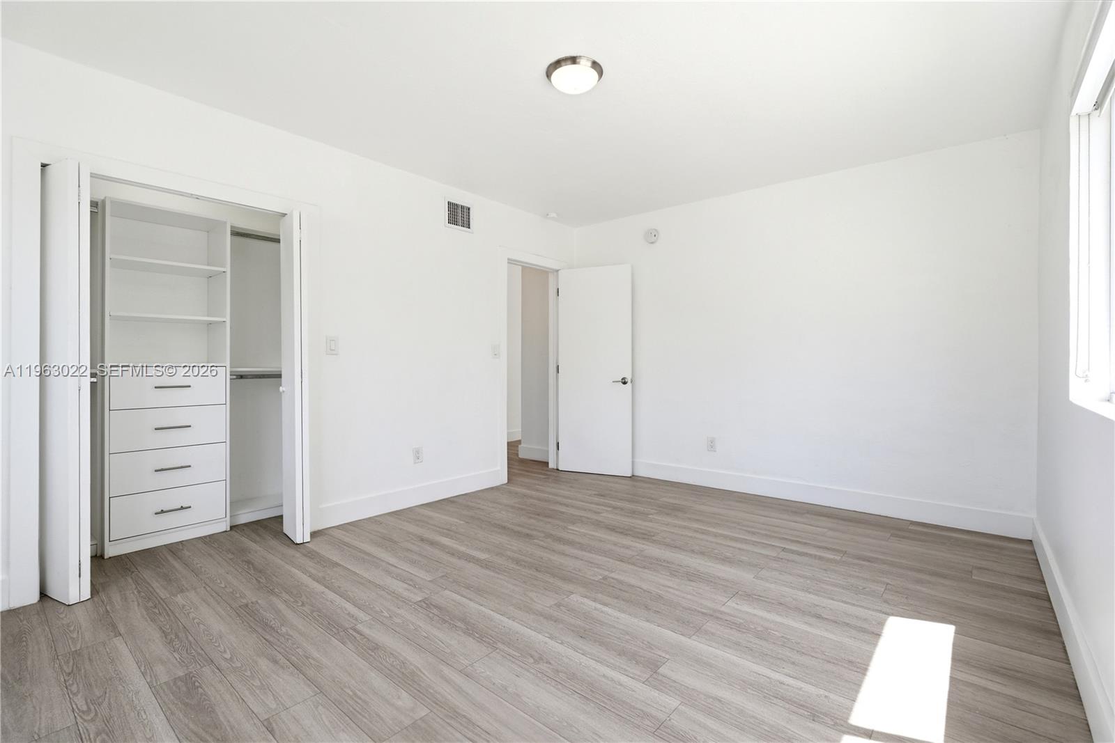 732 82nd Street, Unit 1 Miami Beach, FL 33141 - Photo 9 of 11 wooden floor in an empty room