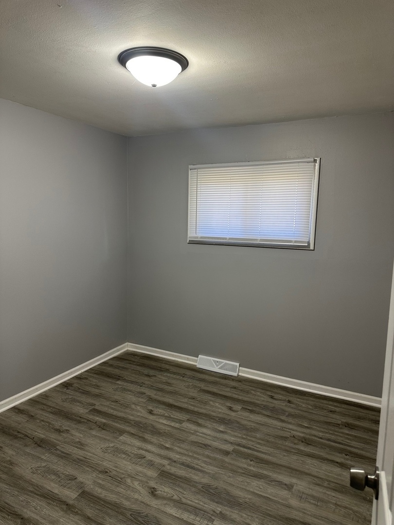 2956 Sherwood Avenue Markham, IL 60428 - Photo 7 of 13 a view of room with wooden floor