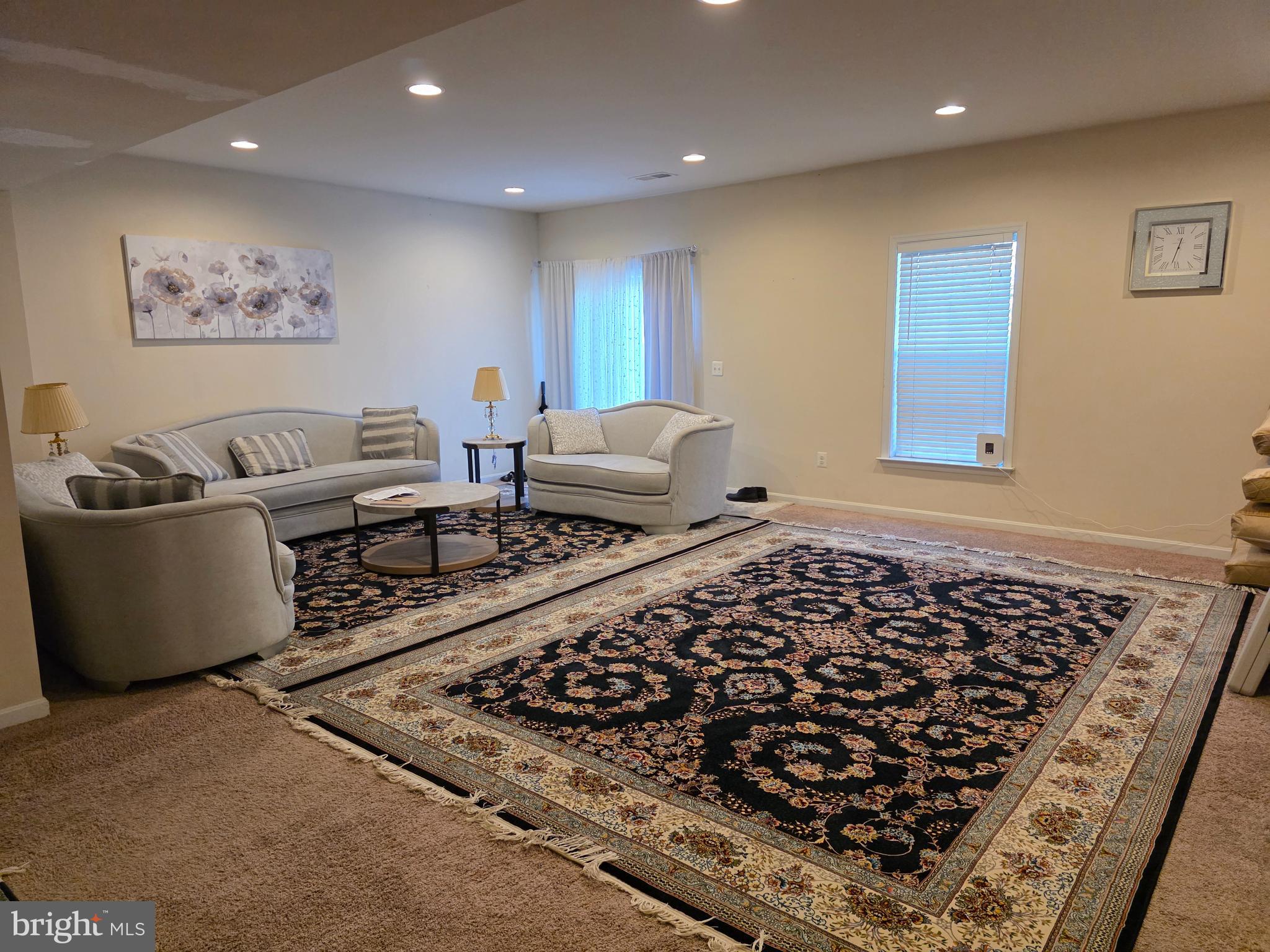 7174 Lyndam Hill Circle Lorton, VA 22079 - Photo 1 of 2 a living room with furniture and a rug