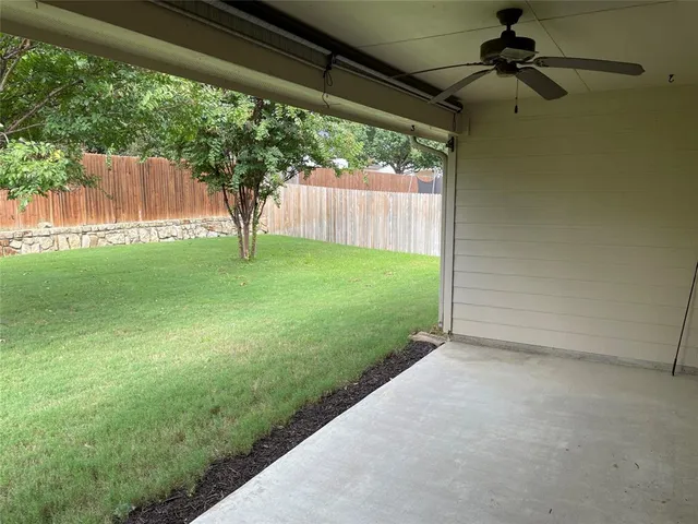 a view of backyard with green space