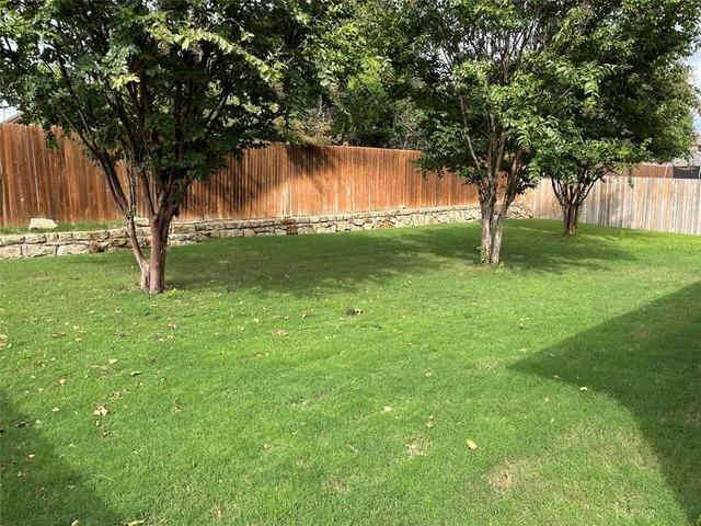 a backyard of a house with lots of green space