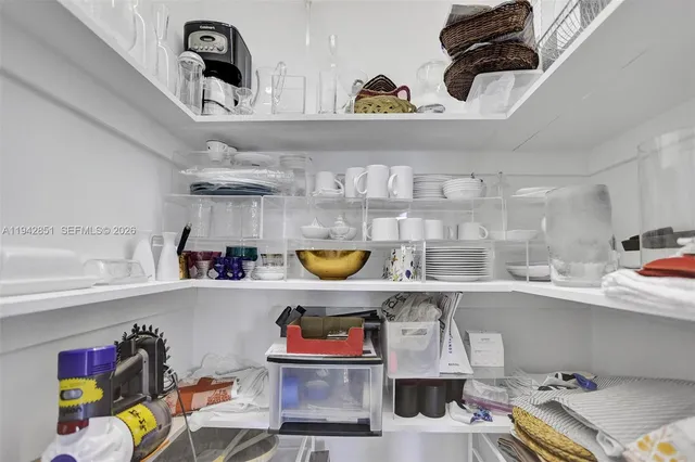 a kitchen with a refrigerator and a sink