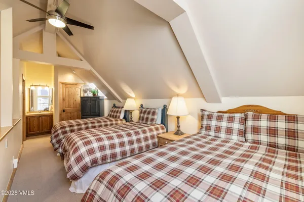 a bedroom with double bed and a window