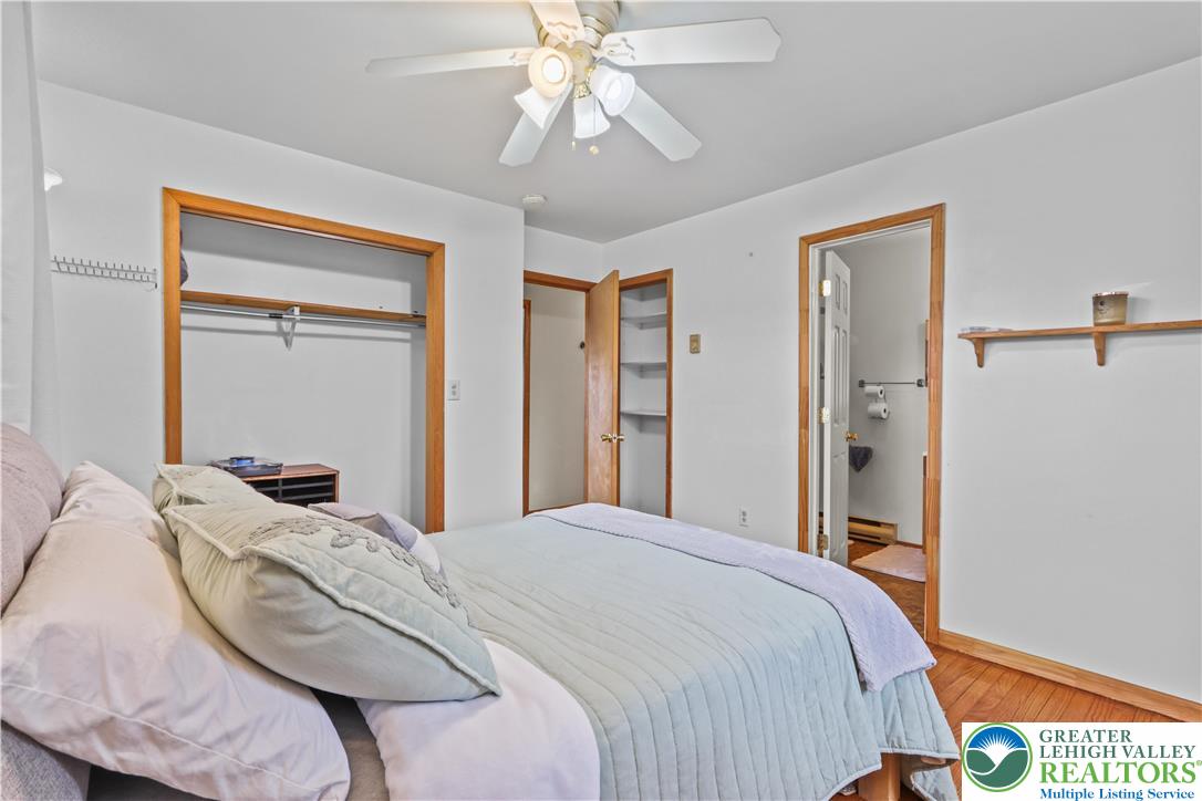 3134 Ross Road Saylorsburg, PA 18353 - Photo 20 of 47 a bedroom with a bed and a chandelier