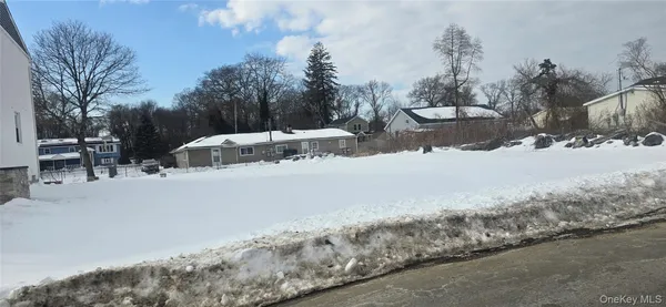a view of a road with a building in the background