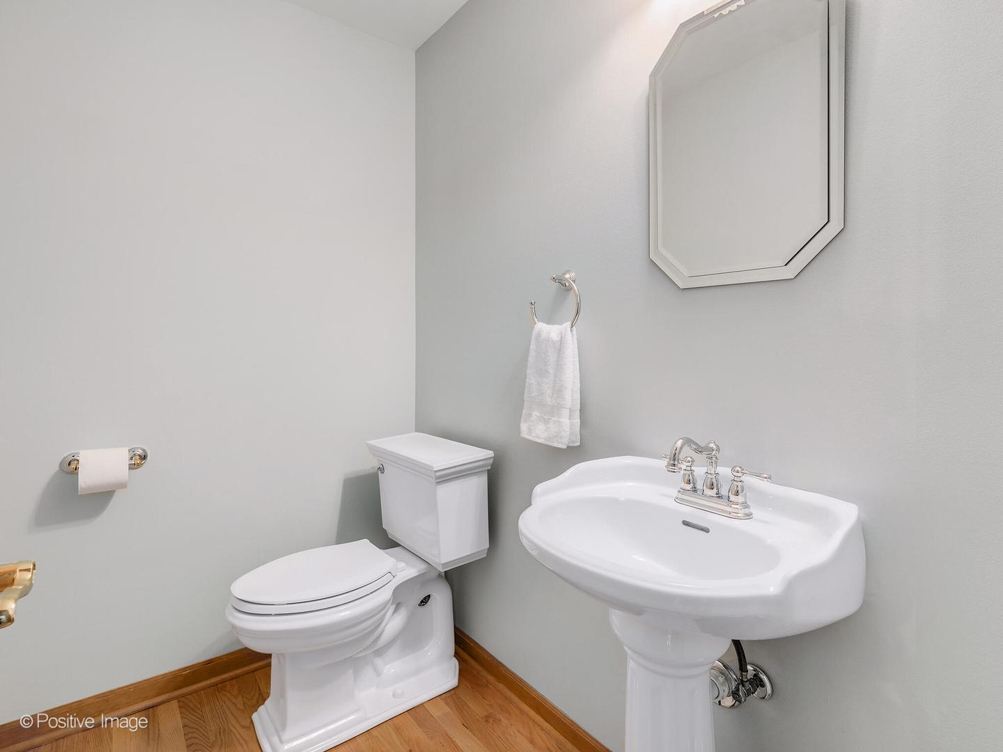 27W220 Jewell Road Winfield, IL 60190 - Photo 16 of 29 a bathroom with a sink a mirror and a toilet