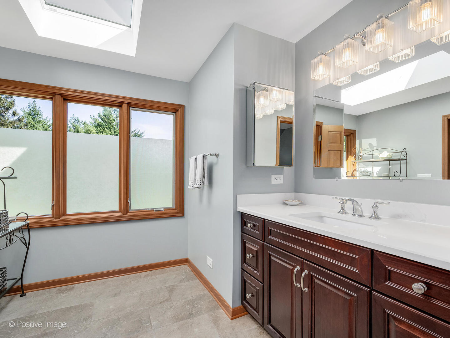27W220 Jewell Road Winfield, IL 60190 - Photo 19 of 29 a bathroom with a sink and a mirror