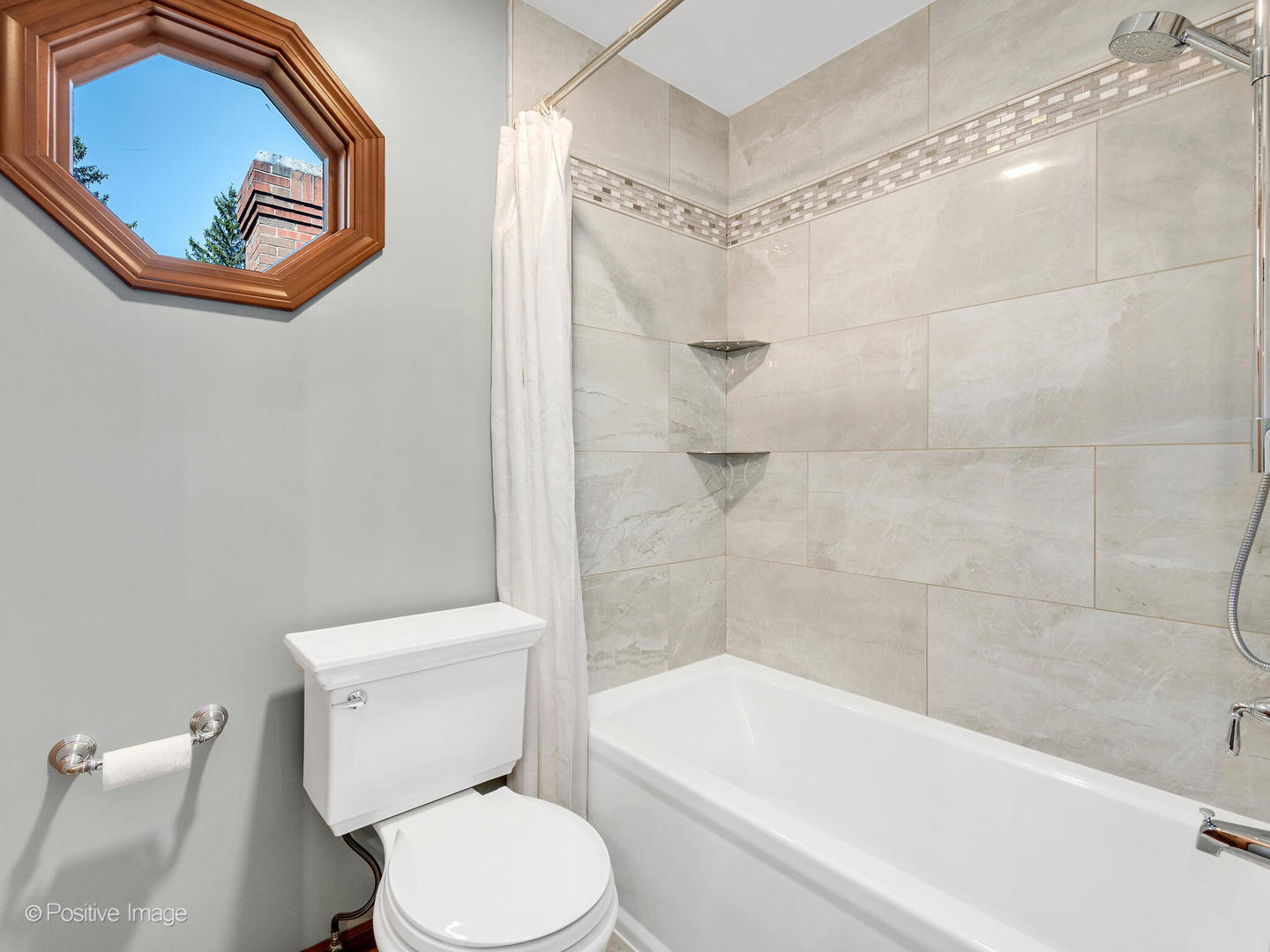 27W220 Jewell Road Winfield, IL 60190 - Photo 23 of 29 a white toilet sitting next to a bath tub and a shower