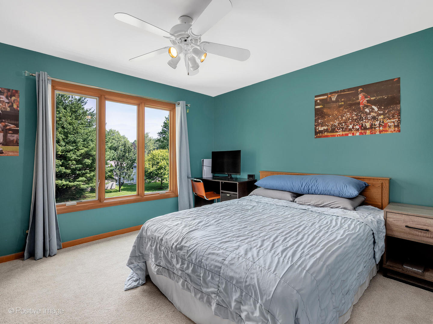 27W220 Jewell Road Winfield, IL 60190 - Photo 24 of 29 a bedroom with a bed and a flat screen tv