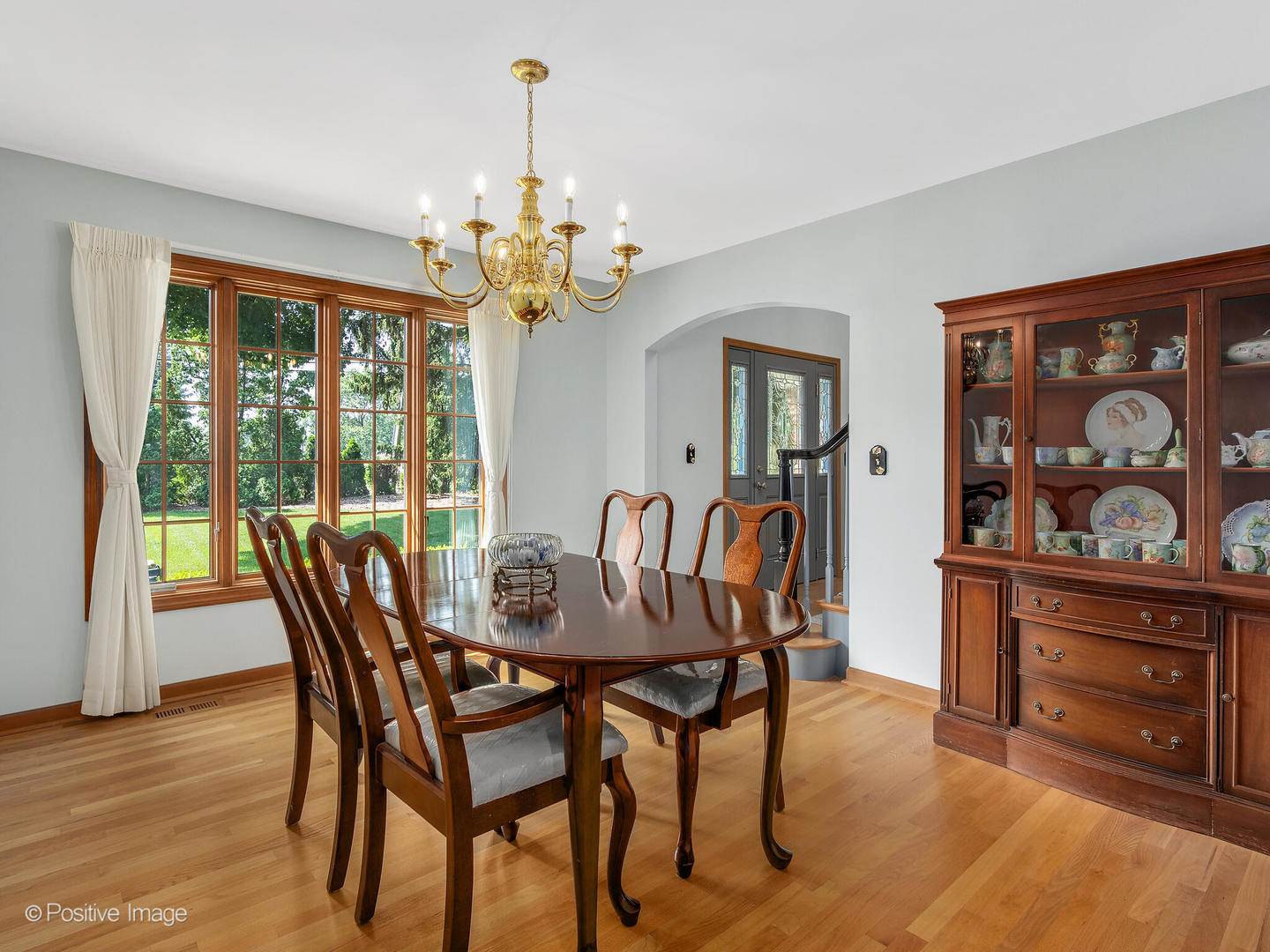 27W220 Jewell Road Winfield, IL 60190 - Photo 9 of 29 a dining room with furniture a chandelier and wooden floor