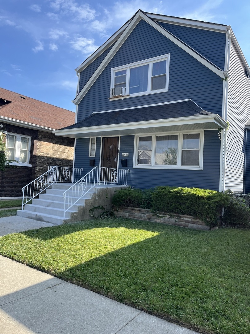 11437 South Calumet Avenue Chicago, IL 60628 - Photo 2 of 11 a front view of a house with garden