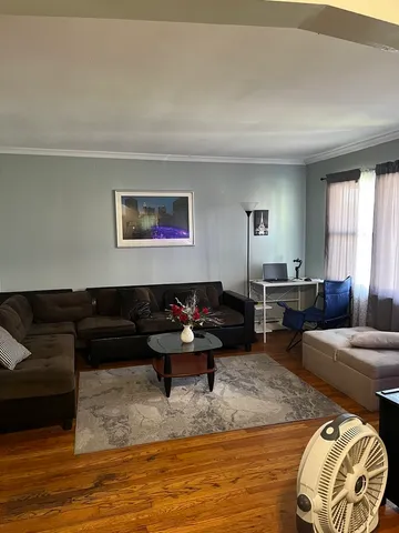 a living room with furniture window and a table