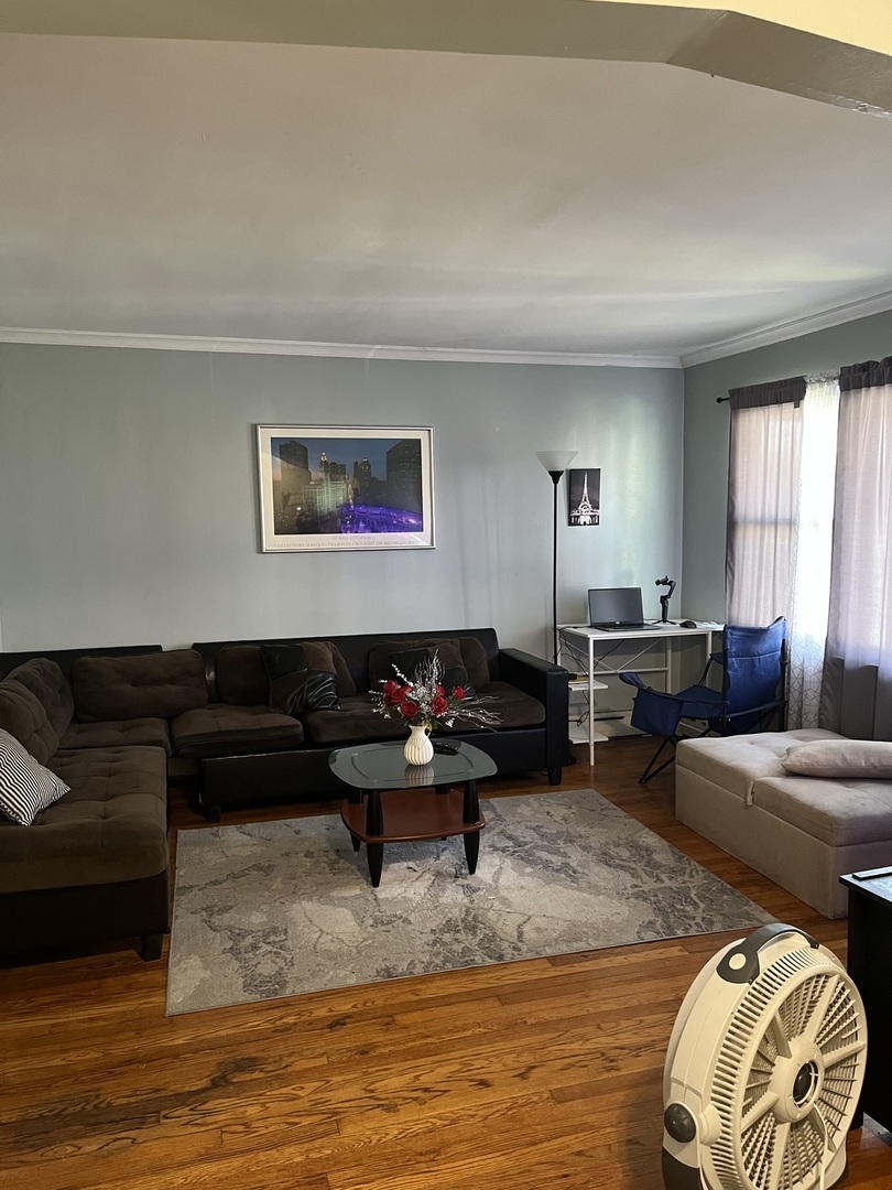 11437 South Calumet Avenue Chicago, IL 60628 - Photo 9 of 11 a living room with furniture window and a table