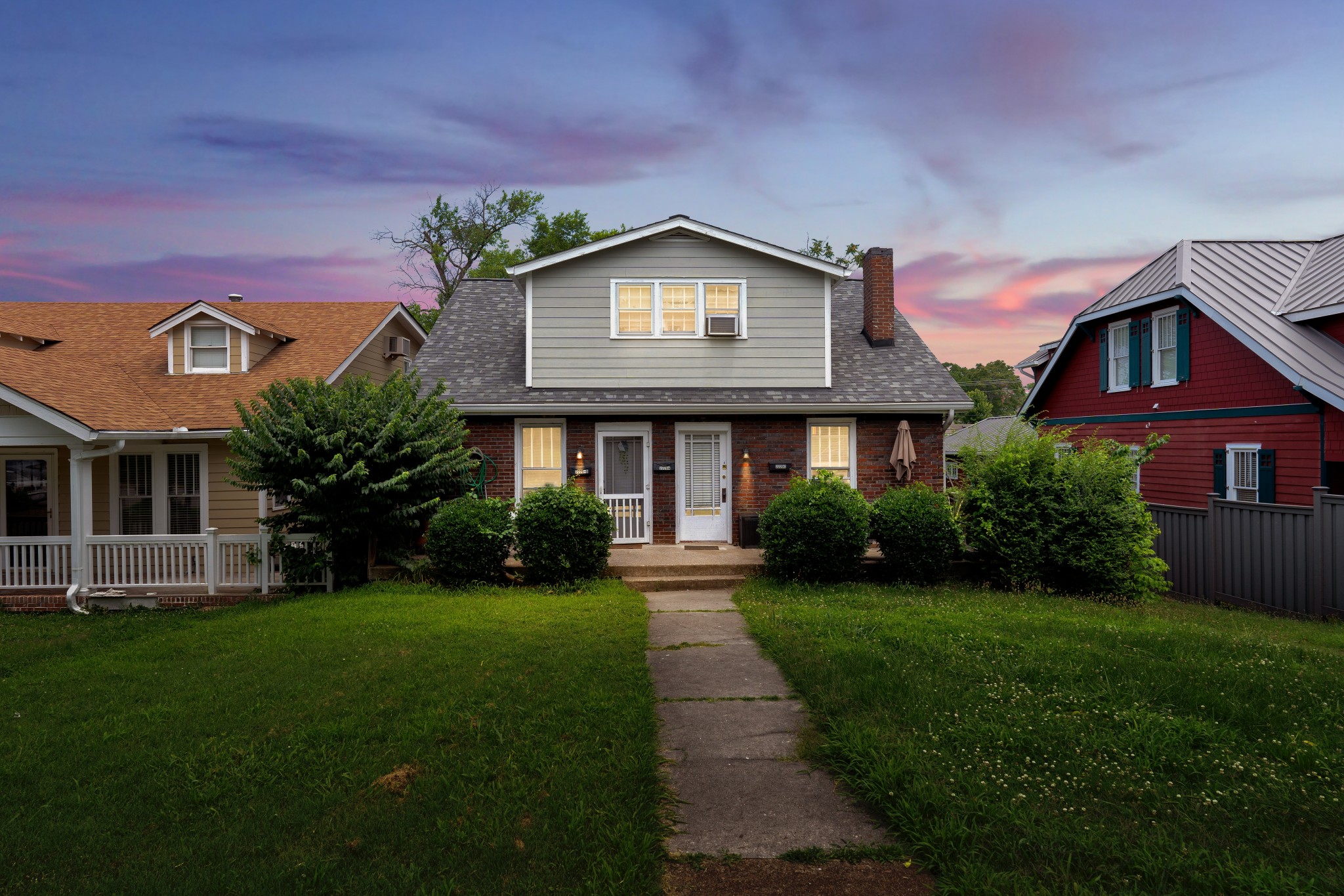 2220 Ashwood Avenue Nashville, TN 37212 - Photo 1 of 13 a front view of a house with a yard and garage