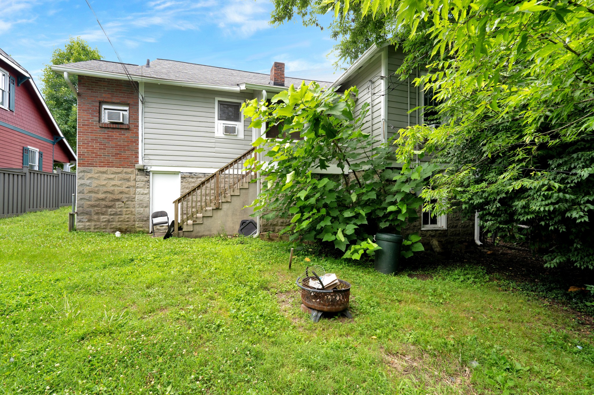 2220 Ashwood Avenue Nashville, TN 37212 - Photo 13 of 13 a view of a backyard with plants and large trees