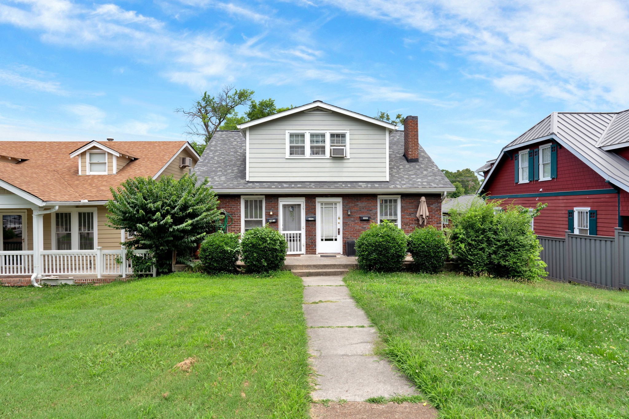 2220 Ashwood Avenue Nashville, TN 37212 - Photo 3 of 13 a front view of a house with a yard and garage