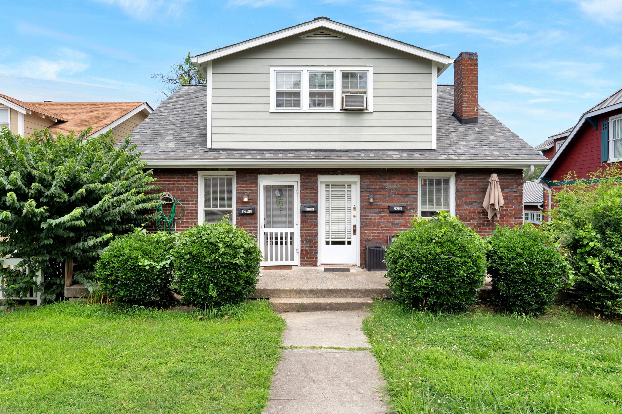 2220 Ashwood Avenue Nashville, TN 37212 - Photo 5 of 13 a front view of a house with garden