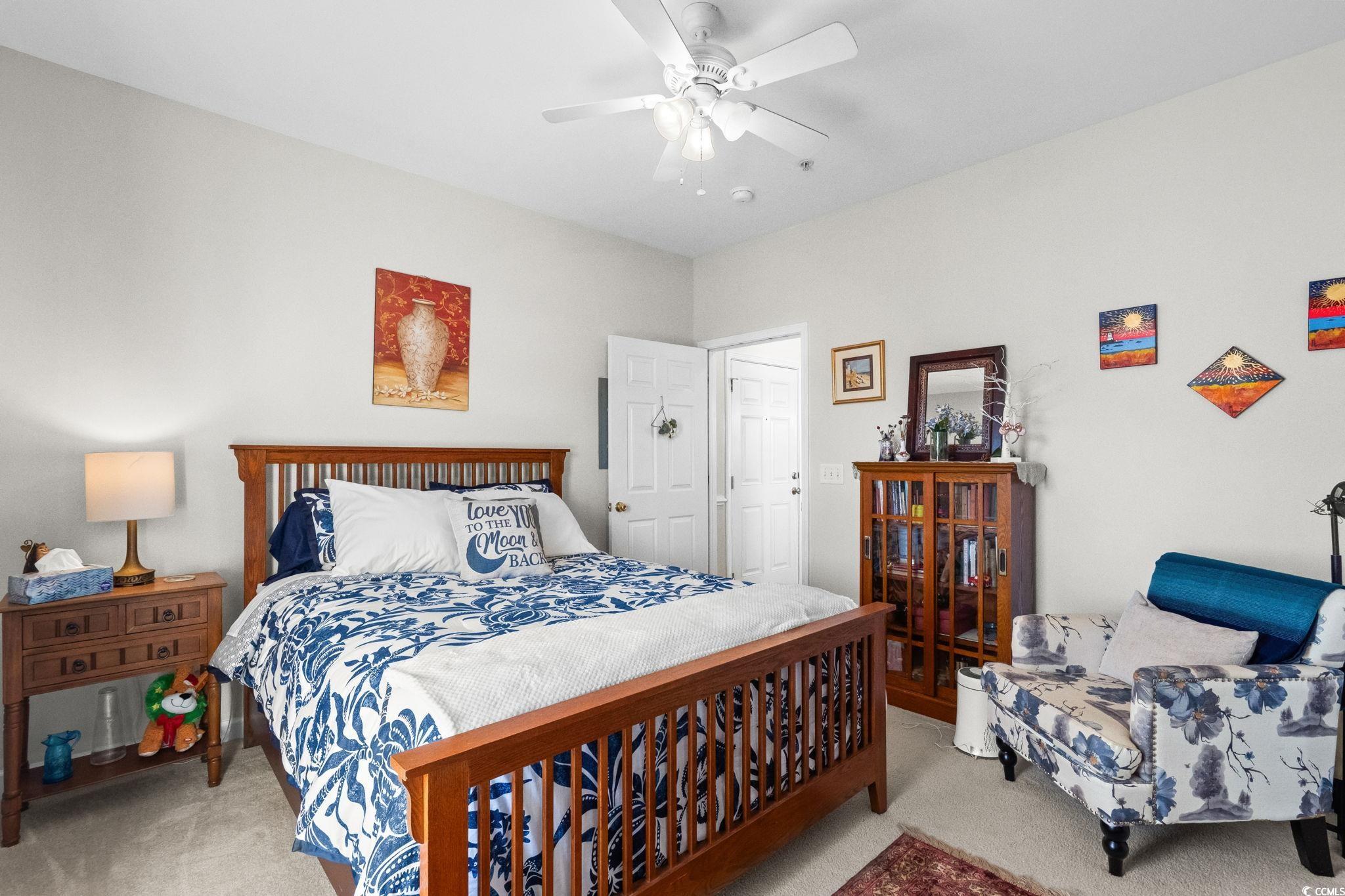 336 Kiskadee Loop, Unit 19O Conway, SC 29526 - Photo 17 of 26 Carpeted bedroom with ceiling fan