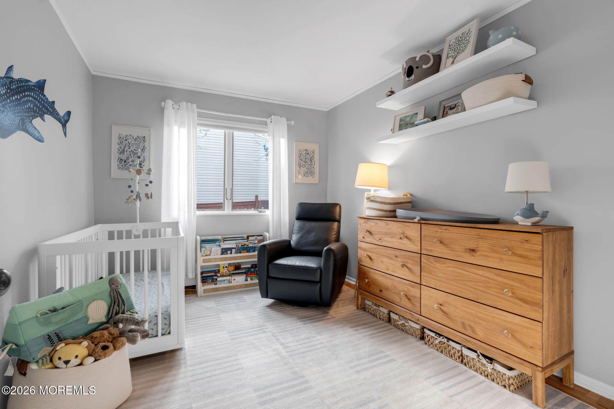 51 7th Street Belford, NJ 07718 - Photo 18 of 26 a bedroom with furniture and a window