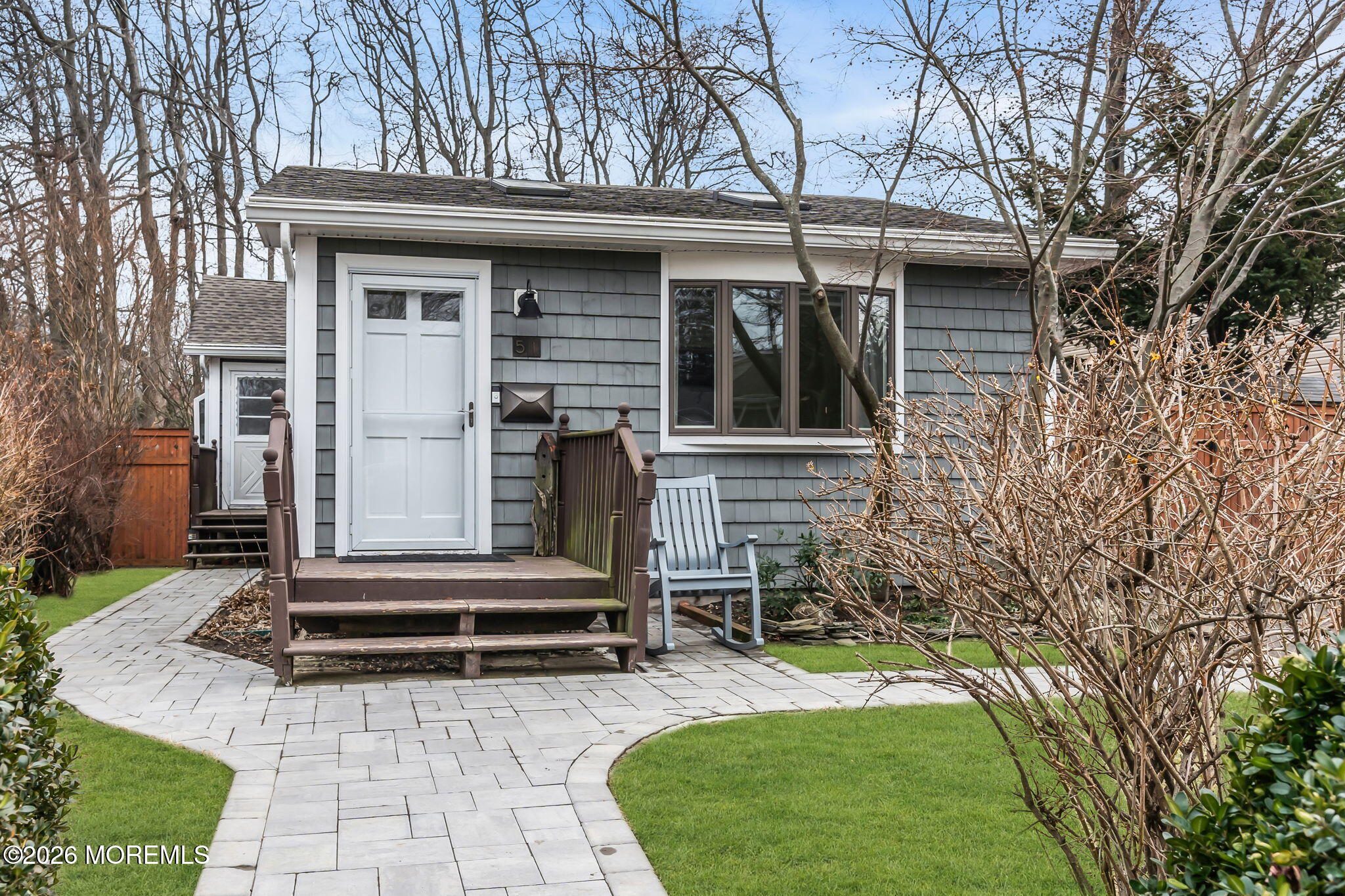 51 7th Street Belford, NJ 07718 - Photo 2 of 26 a small garden in the corners of a house