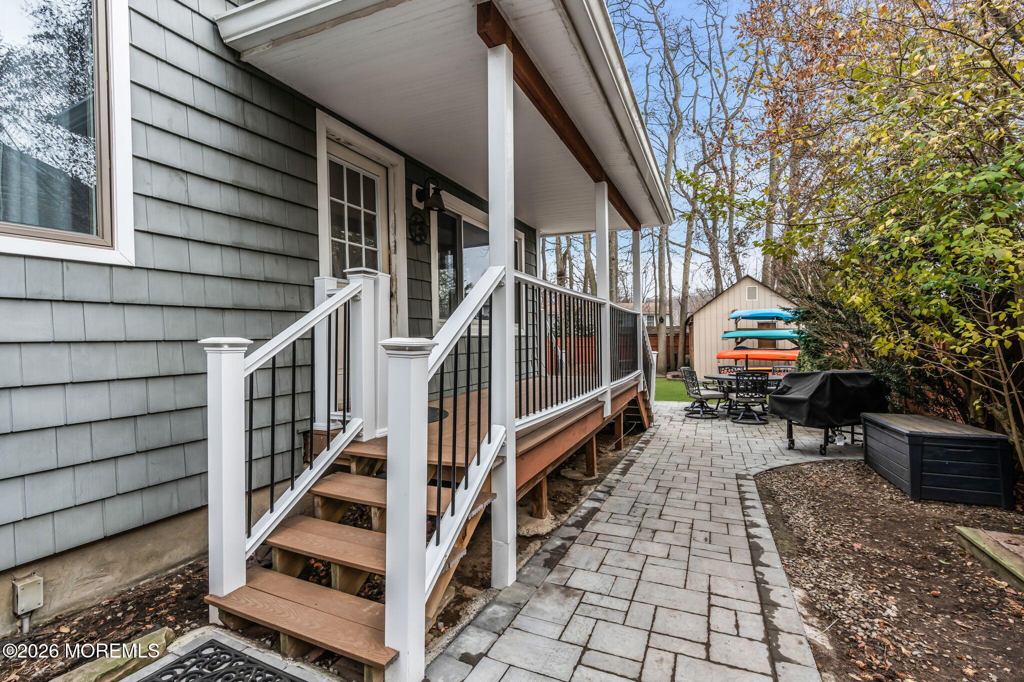 51 7th Street Belford, NJ 07718 - Photo 21 of 26 a view of house with wooden stairs and furniture