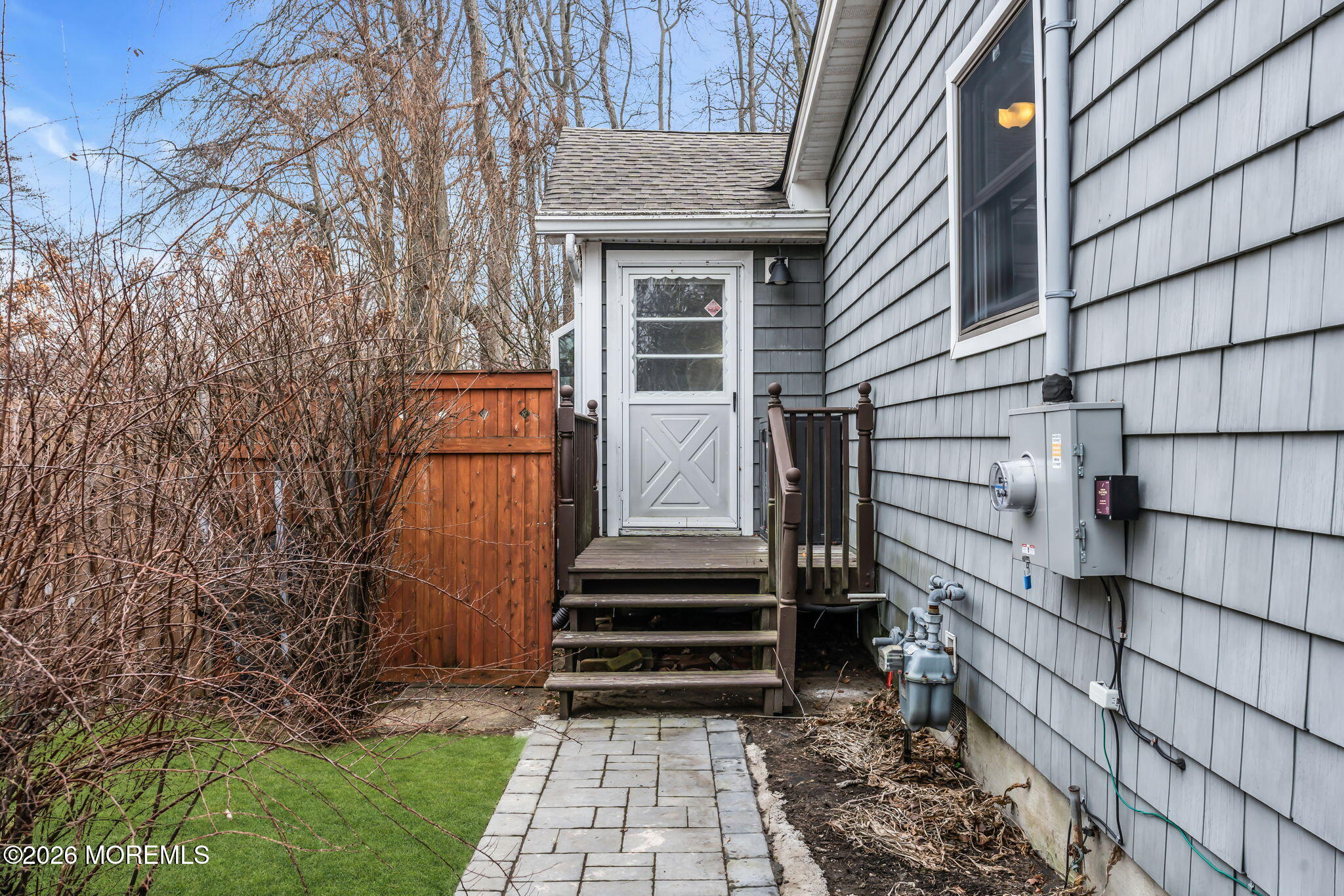 51 7th Street Belford, NJ 07718 - Photo 3 of 26 a front view of a house with a yard