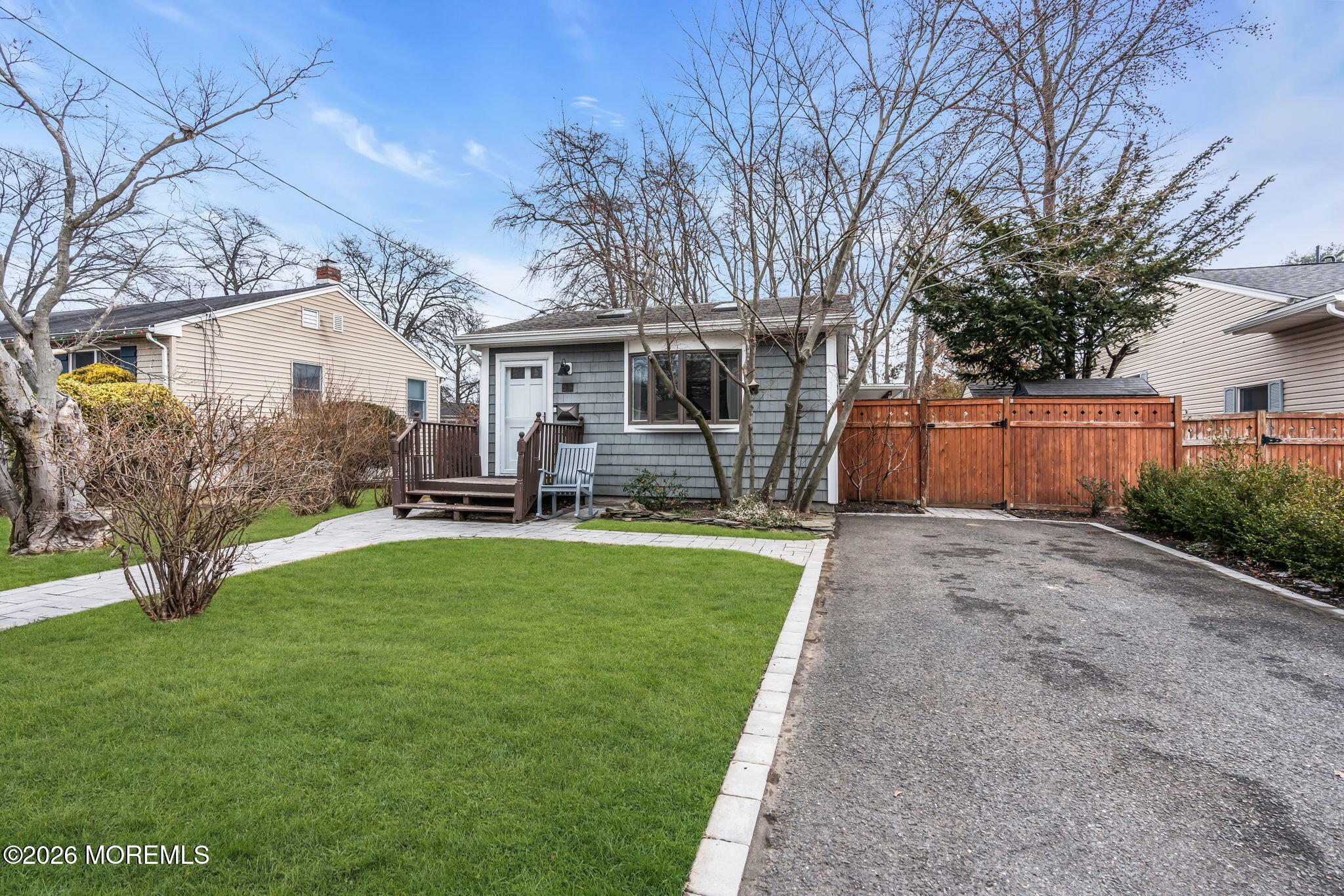 51 7th Street Belford, NJ 07718 - Photo 4 of 26 a front view of house with yard and green space