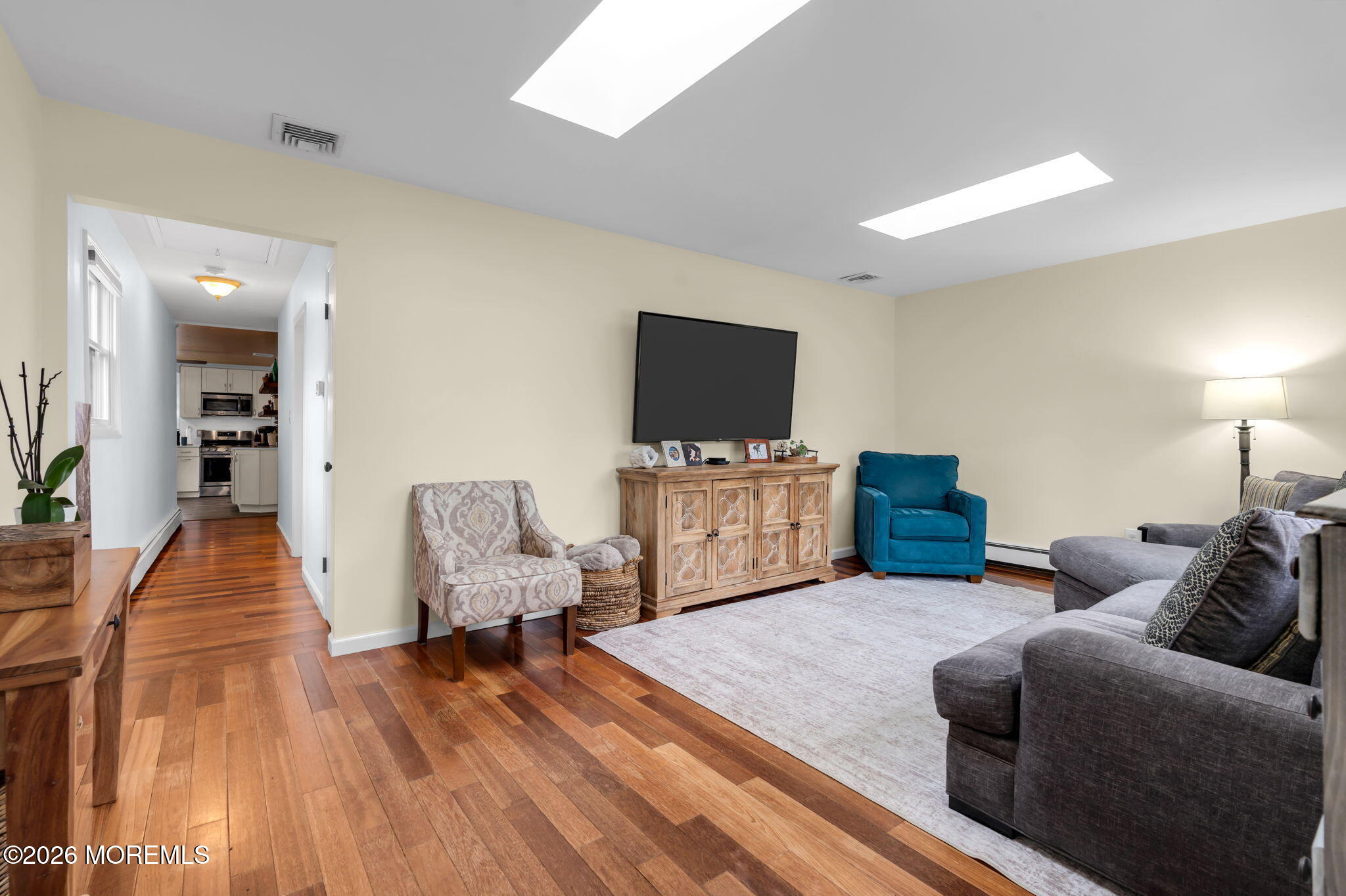51 7th Street Belford, NJ 07718 - Photo 5 of 26 a living room with furniture and a flat screen tv