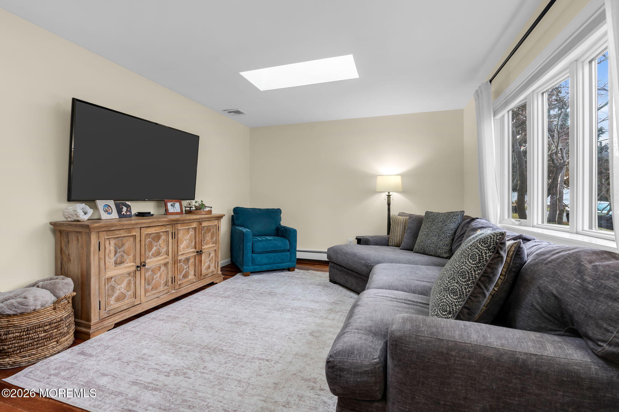 51 7th Street Belford, NJ 07718 - Photo 6 of 26 a living room with furniture and a flat screen tv