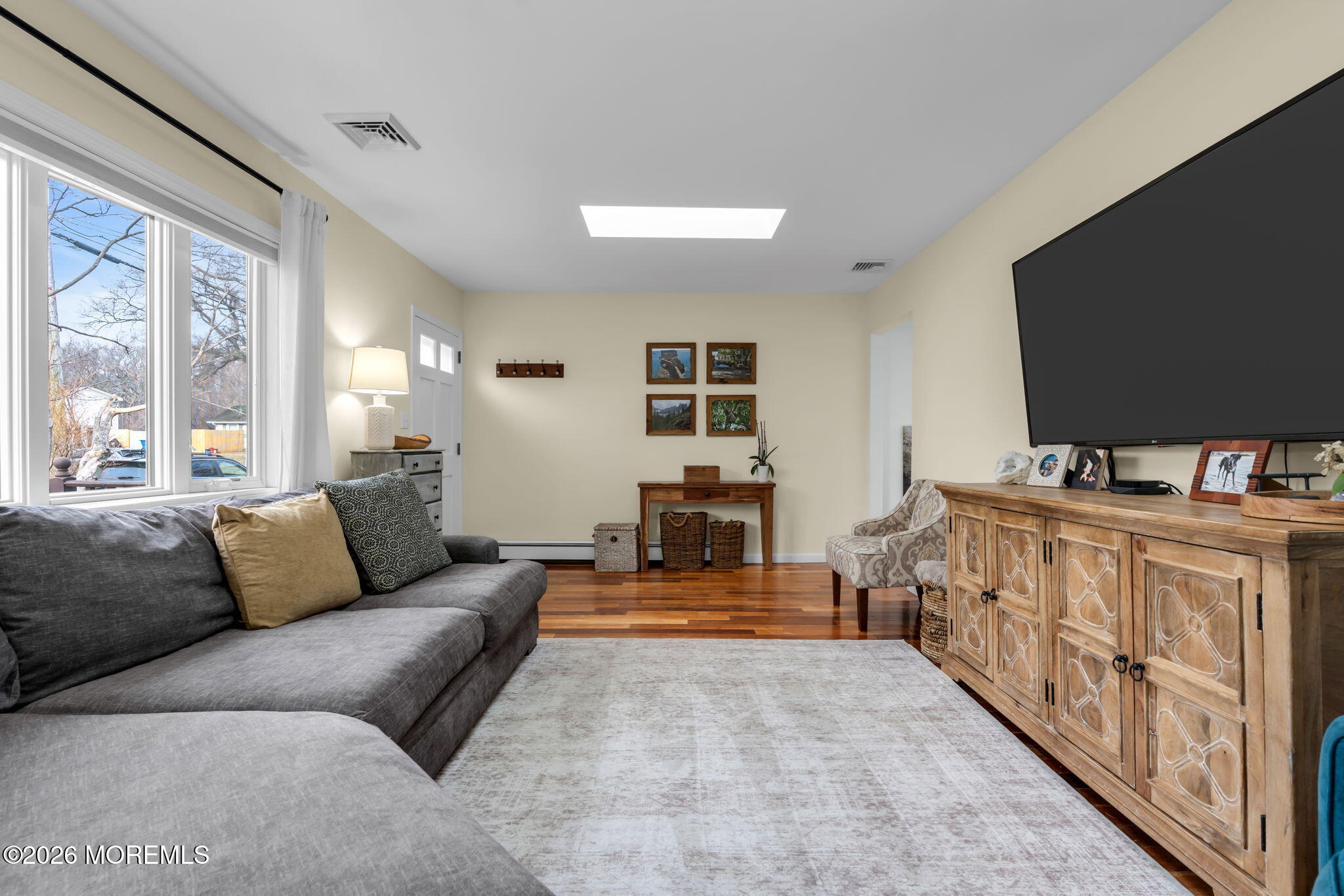 51 7th Street Belford, NJ 07718 - Photo 7 of 26 a living room with furniture and a flat screen tv