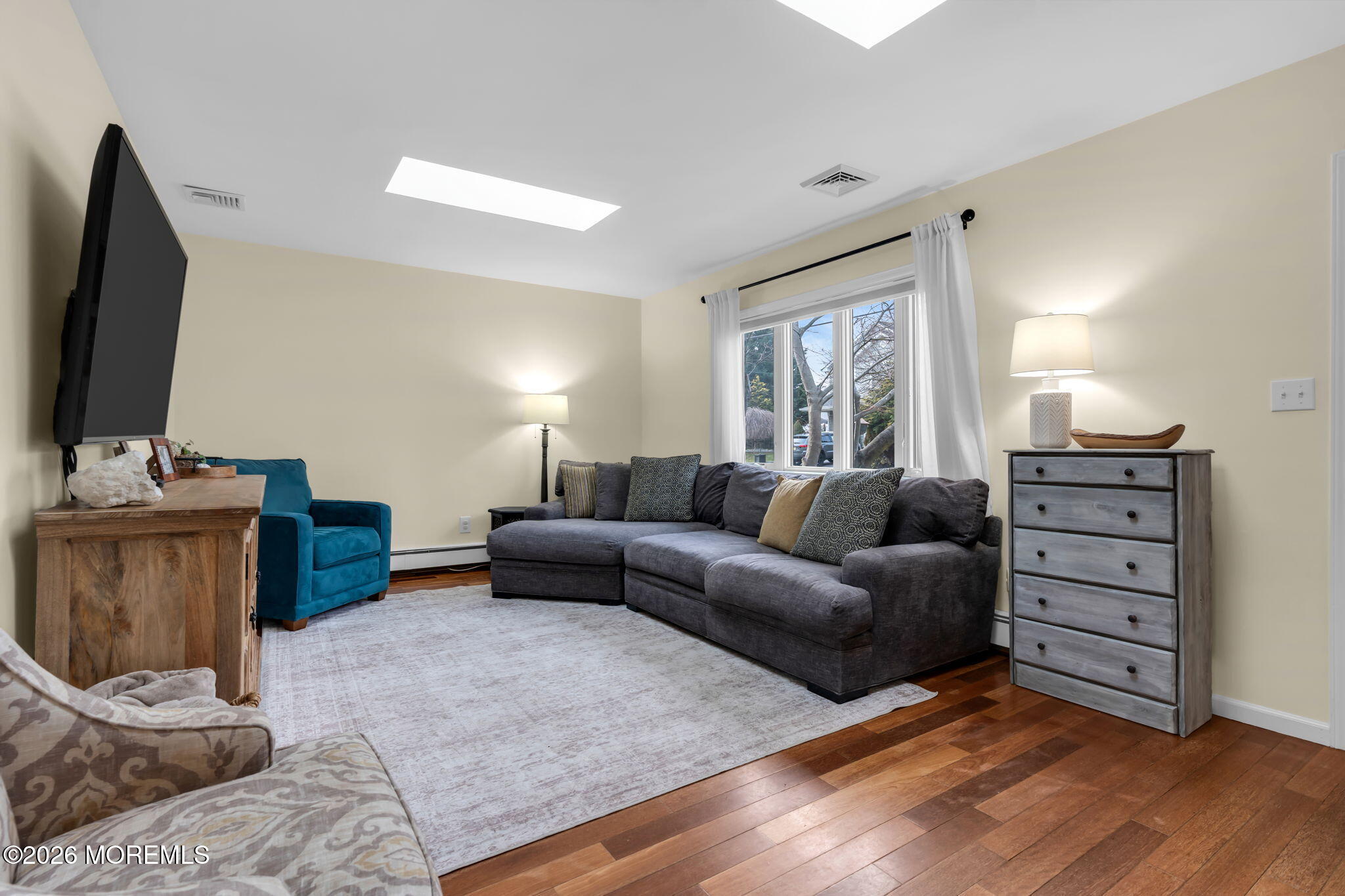 51 7th Street Belford, NJ 07718 - Photo 8 of 26 a living room with furniture and a flat screen tv