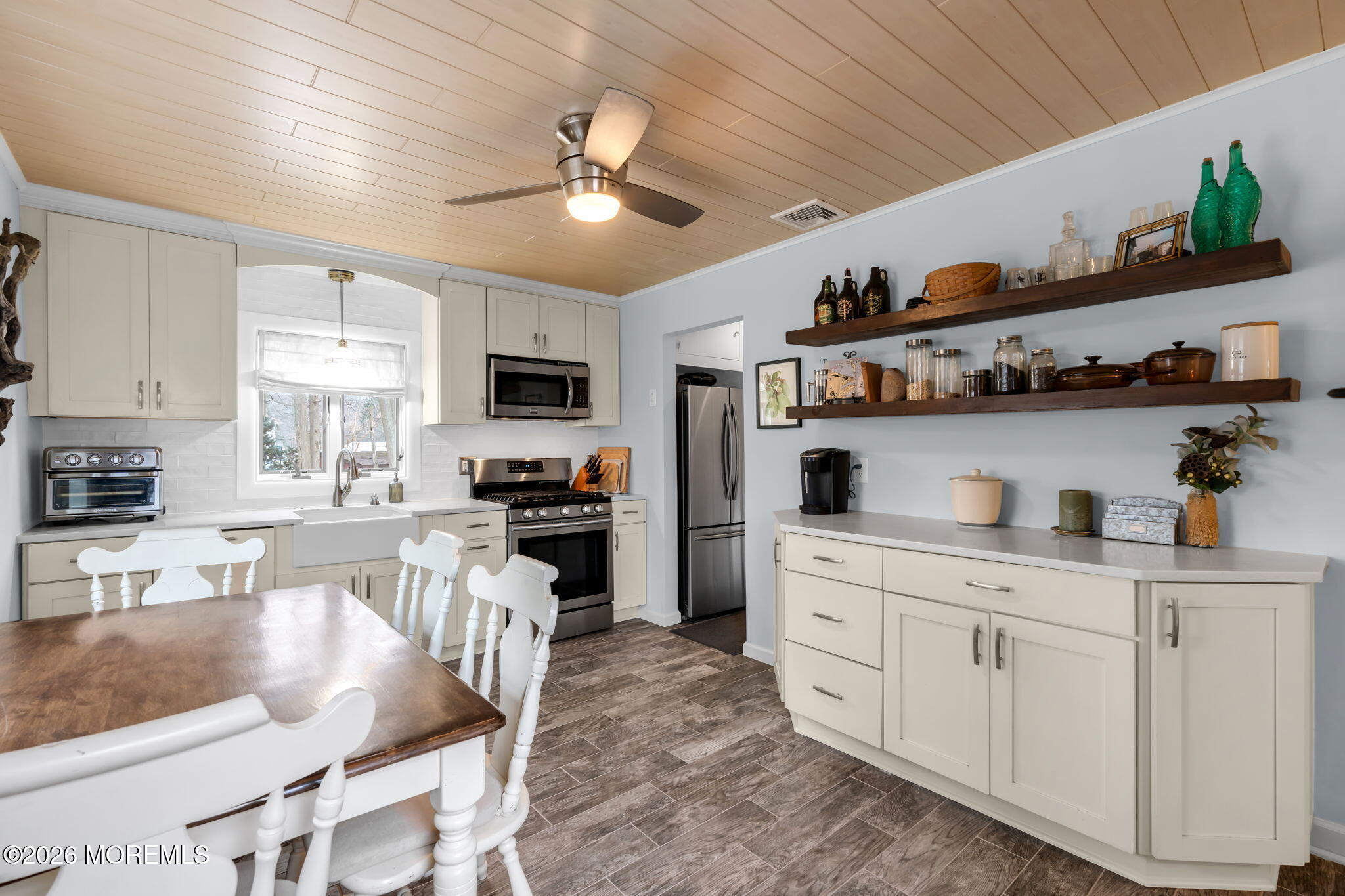 51 7th Street Belford, NJ 07718 - Photo 10 of 26 a kitchen with cabinets a sink and appliances
