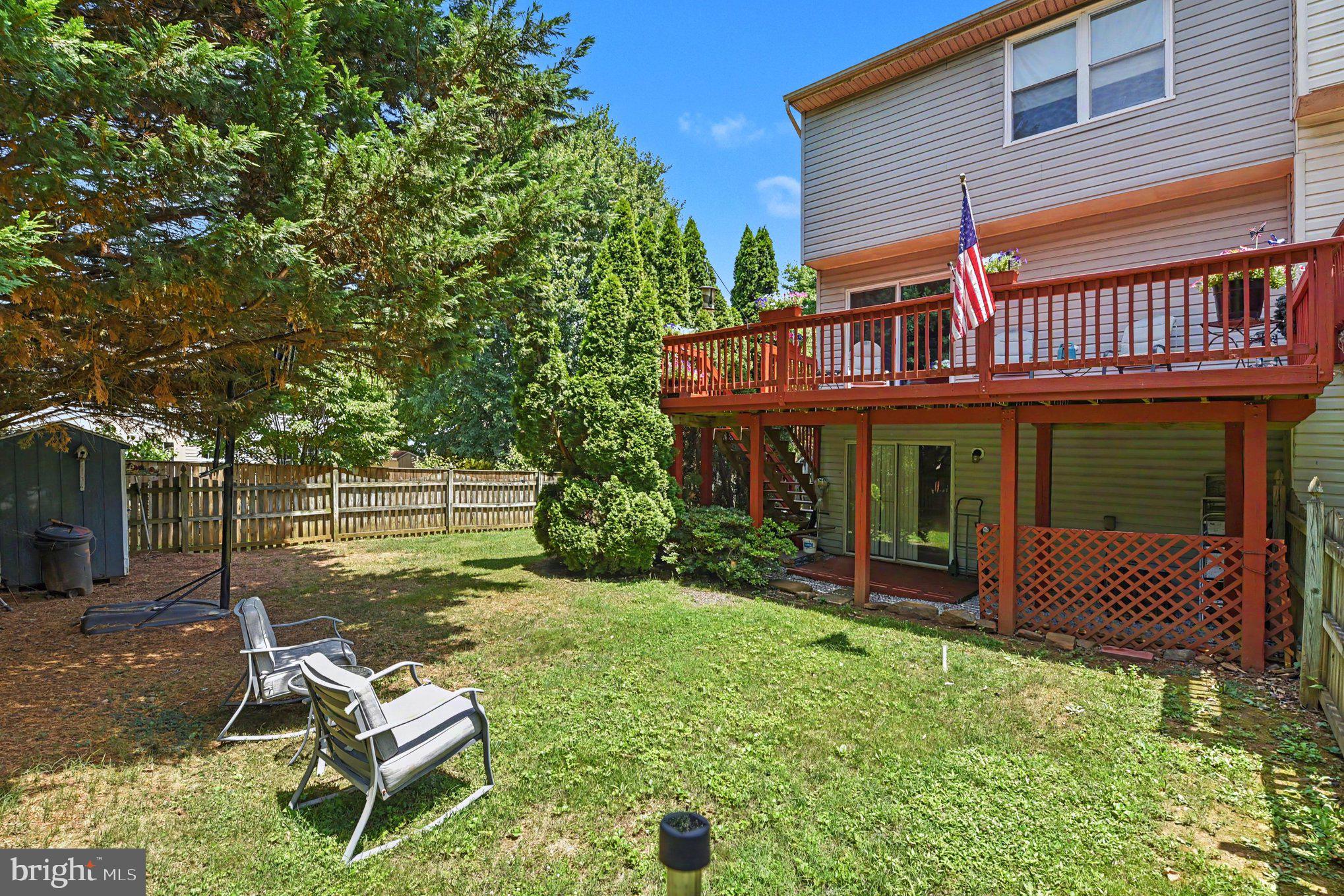 72 Powder View Court Nottingham, MD 21236 - Photo 25 of 26 Charming backyard with deck and greenery.
