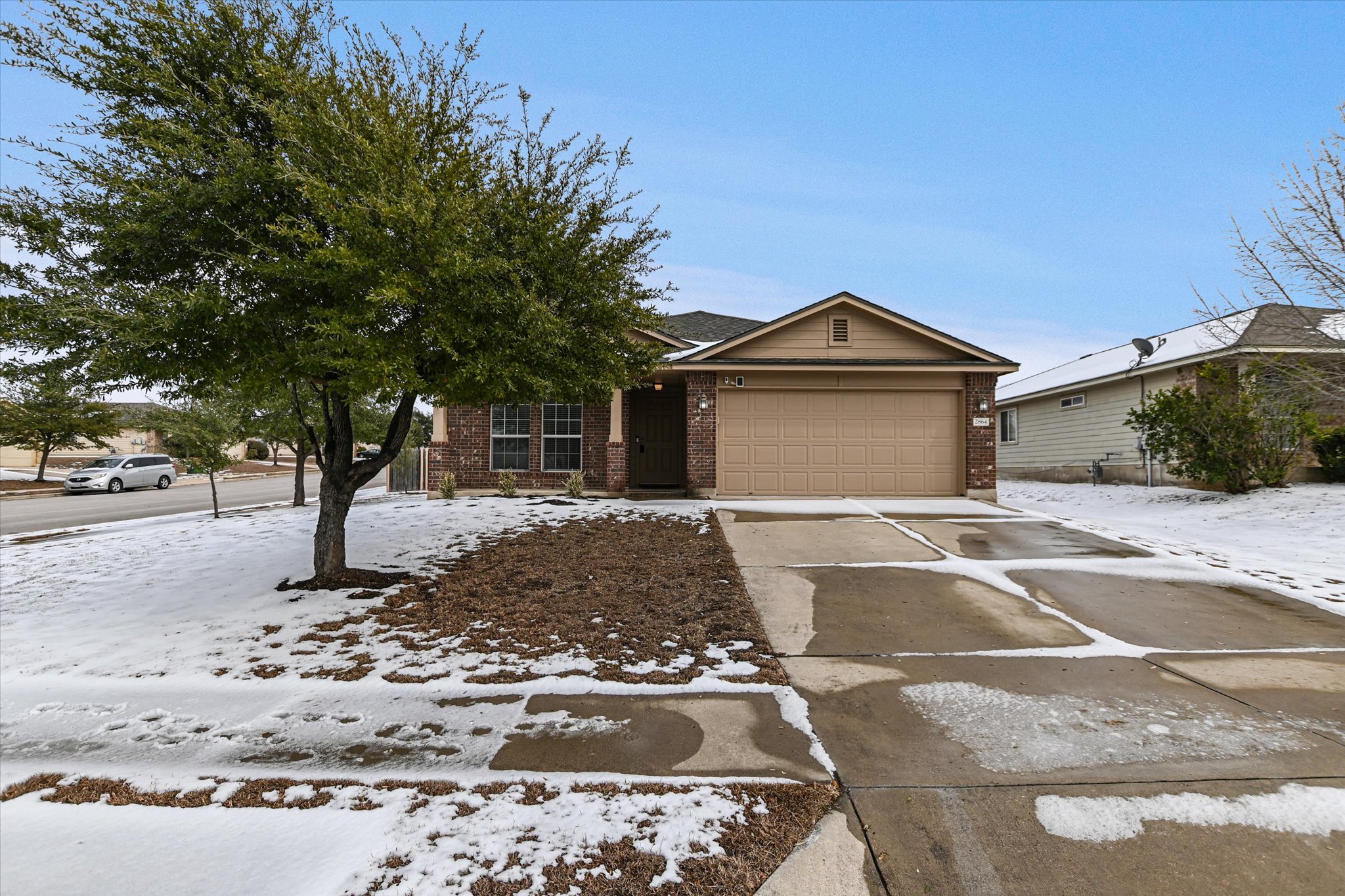 2864 Hearthsong Loop Round Rock, TX 78665 - Photo 1 of 29 View of front facade featuring brick siding, driveway, and a garage