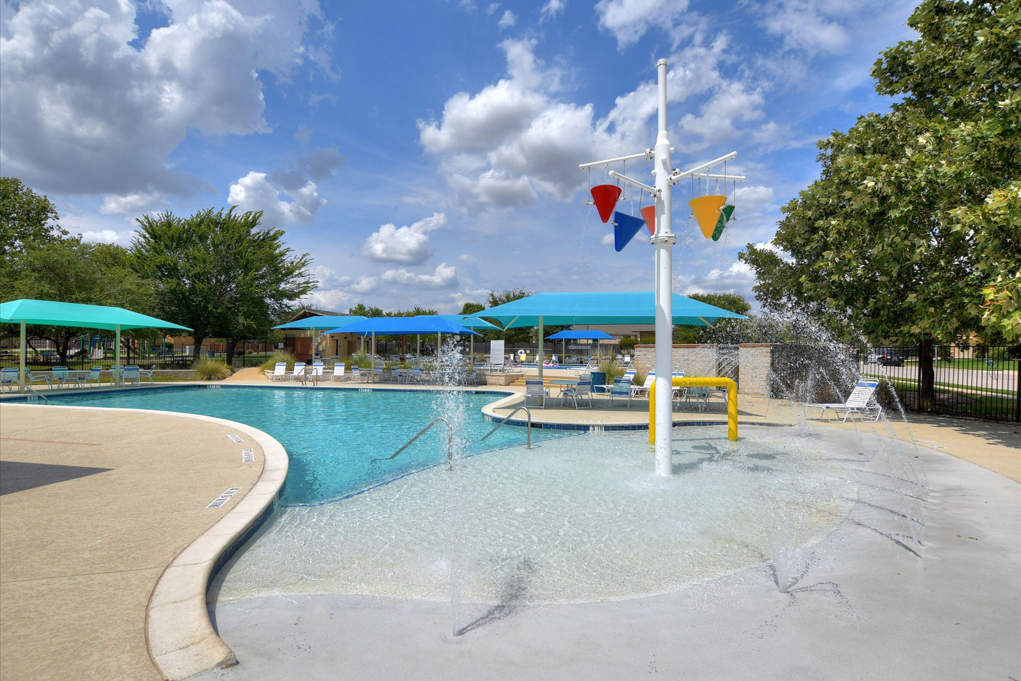2864 Hearthsong Loop Round Rock, TX 78665 - Photo 27 of 29 Community pool with a patio area and a water play area