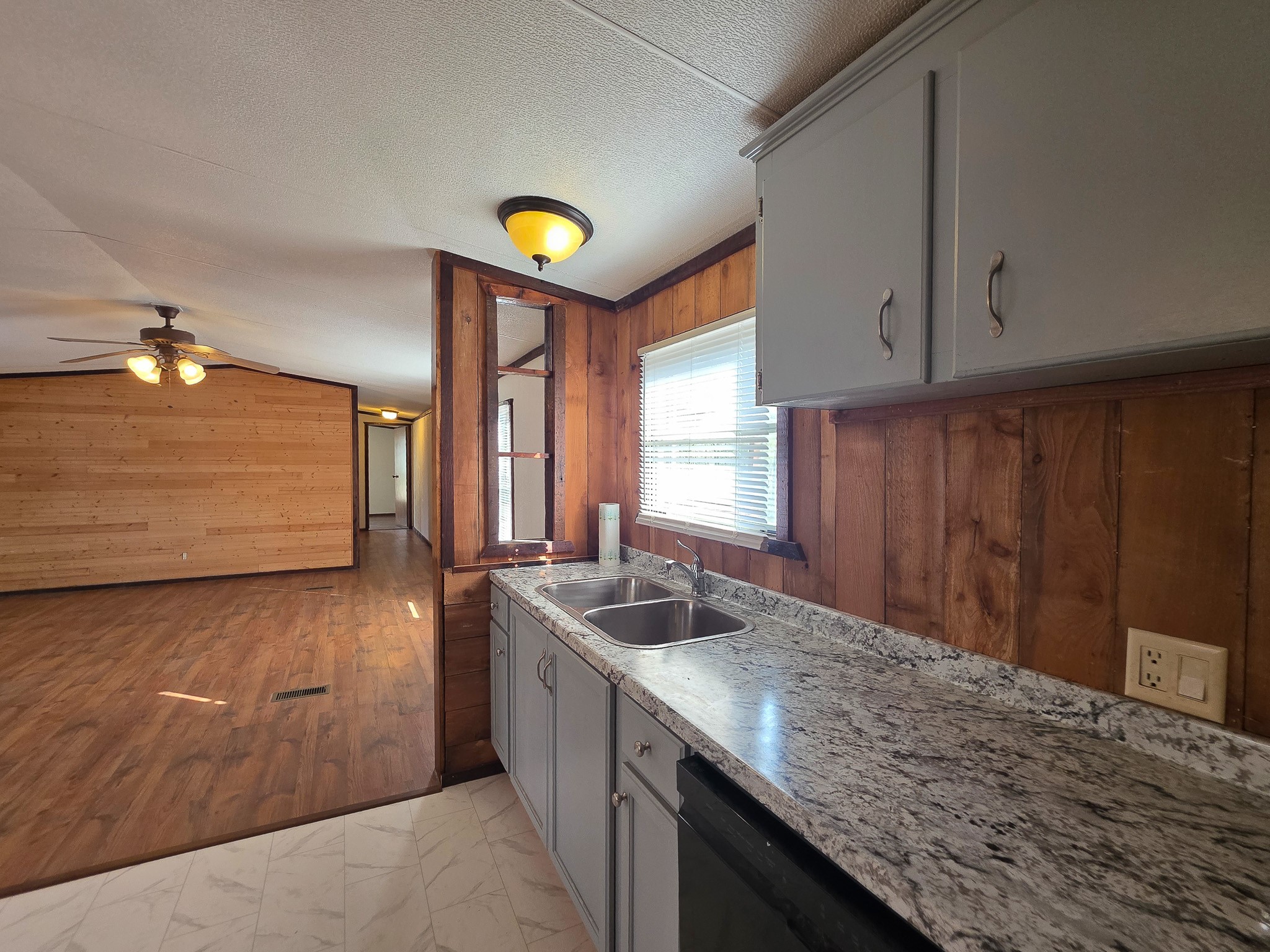 344 Holmes Road Onalaska, TX 77360 - Photo 11 of 25 309 Holmes view from kitchen into living room