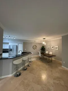 a view of a living room and dining room