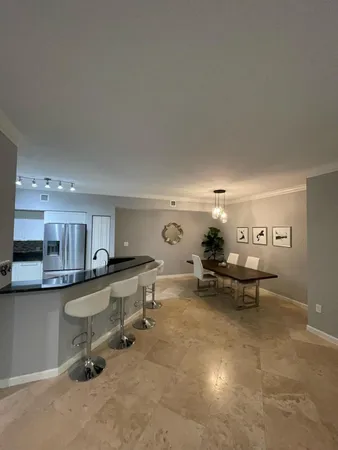 a view of a living room and dining room