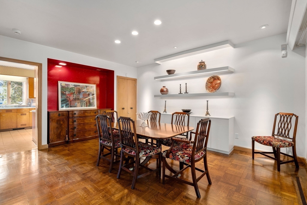 474 Salisbury Street Worcester, MA 01609 - Photo 12 of 40 a view of a dining room and livingroom with furniture a rug a painting and a chandelier
