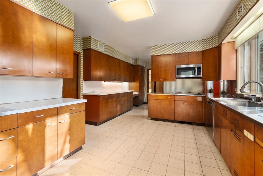 474 Salisbury Street Worcester, MA 01609 - Photo 17 of 40 a kitchen with stainless steel appliances a sink counter top space cabinets and a window