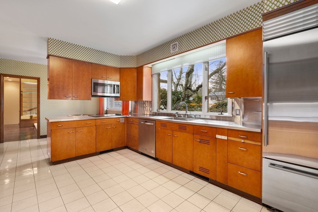 474 Salisbury Street Worcester, MA 01609 - Photo 18 of 40 a kitchen with stainless steel appliances granite countertop a refrigerator and a sink