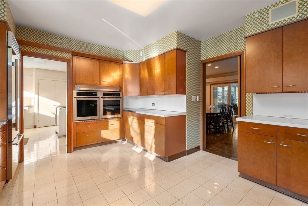 474 Salisbury Street Worcester, MA 01609 - Photo 19 of 40 a large kitchen with stainless steel appliances kitchen island granite countertop a large counter top and a stove