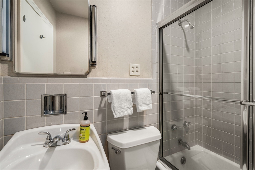 474 Salisbury Street Worcester, MA 01609 - Photo 30 of 40 a bathroom with a sink and a mirror toilet