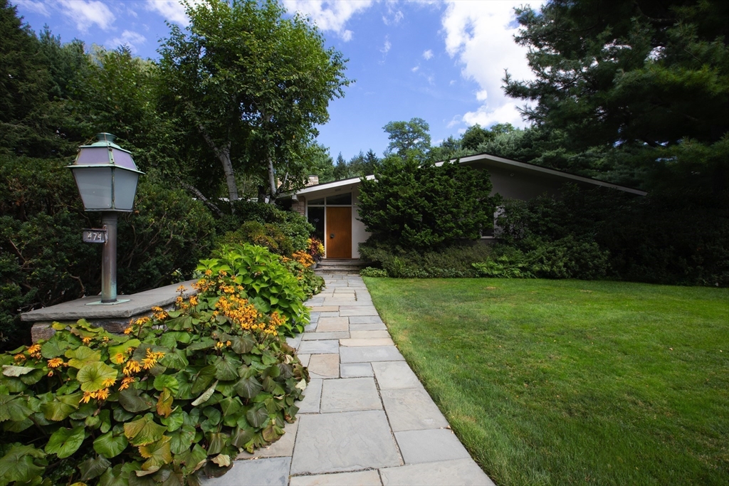 474 Salisbury Street Worcester, MA 01609 - Photo 3 of 40 a view of a pathway with a flower garden