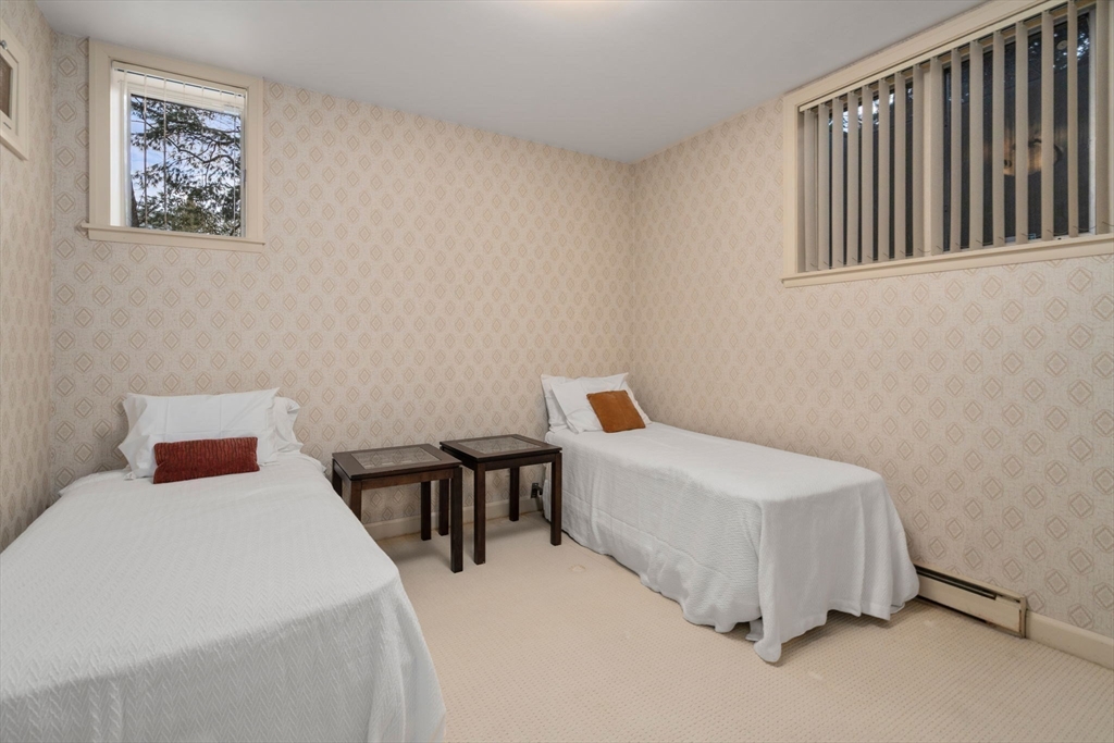 474 Salisbury Street Worcester, MA 01609 - Photo 32 of 40 a bedroom with a bed and a table