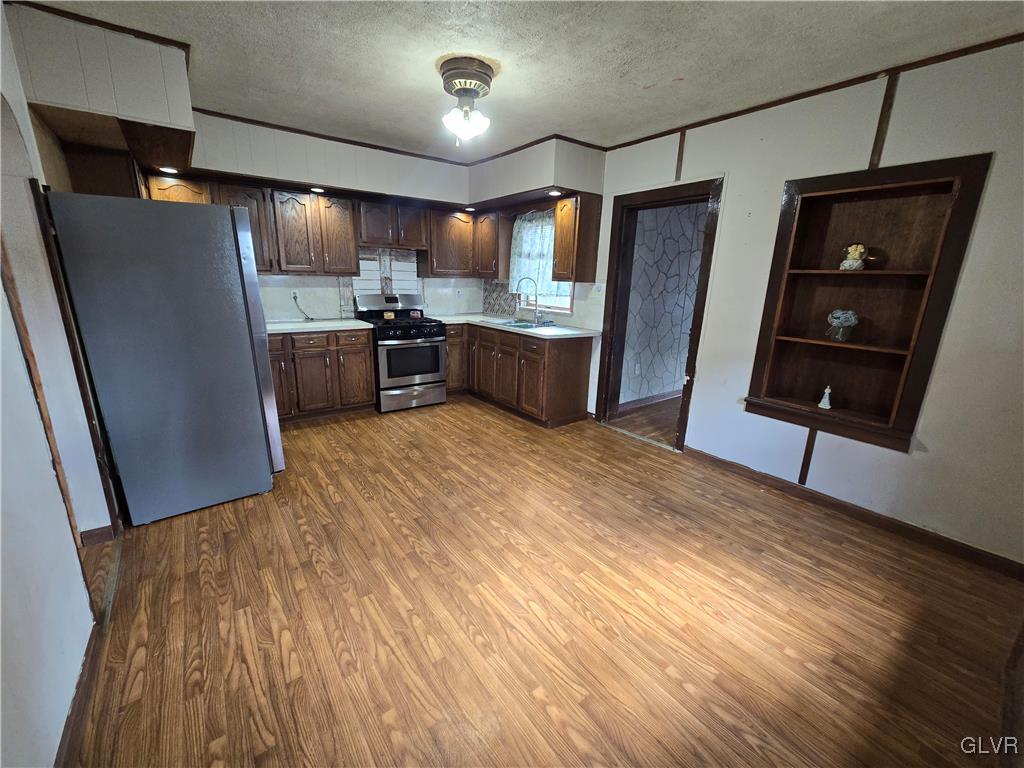 1015 Oak Street Coplay, PA 18037 - Photo 12 of 23 a kitchen with stainless steel appliances a refrigerator and a sink